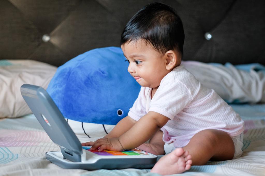 baby typing on a laptop